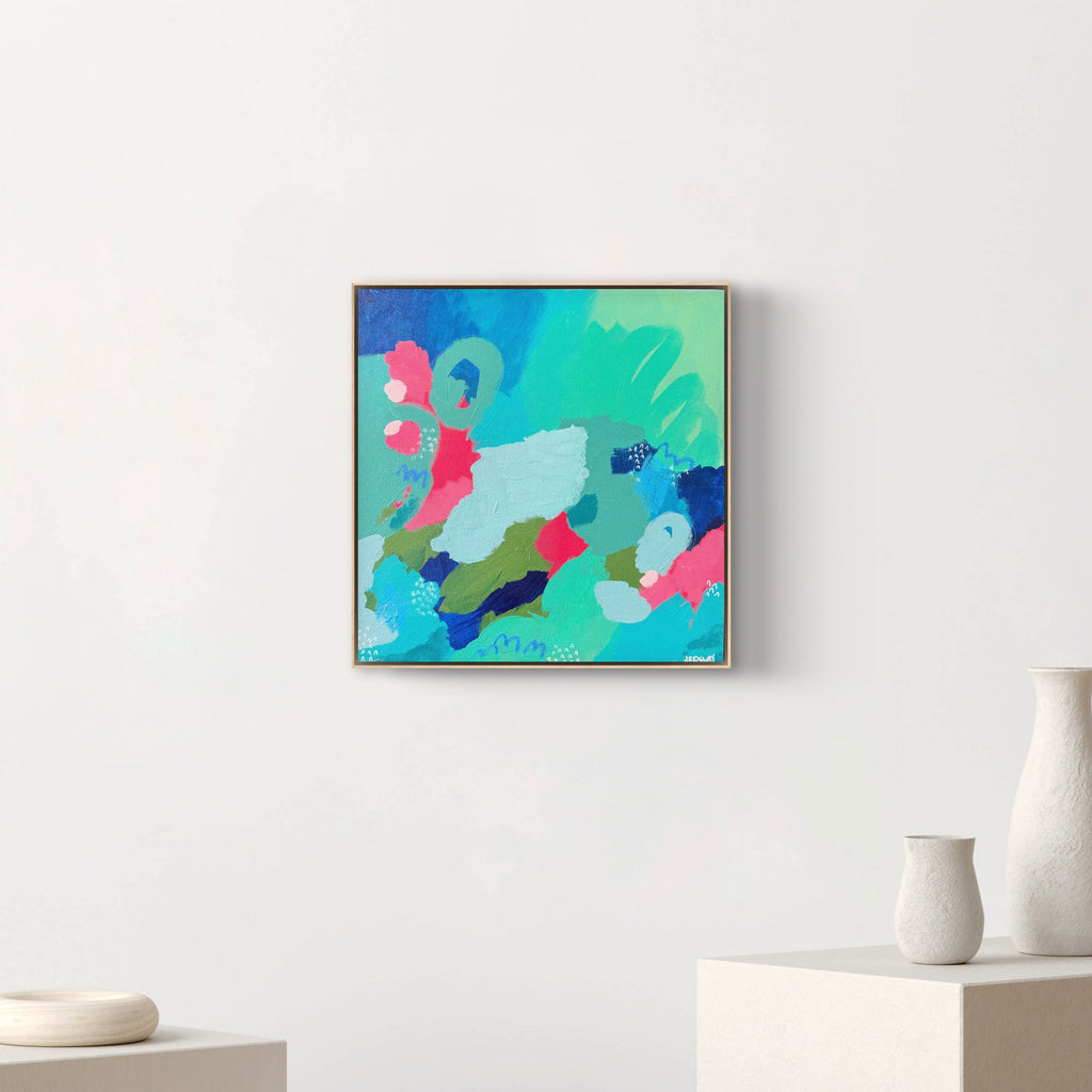Abstract colorful painting on a white wall with minimal decor